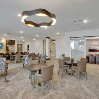 A modern dining area with stylish lighting and comfortable seating.