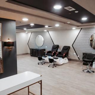 A modern salon interior with pedicure stations and stylish decor.