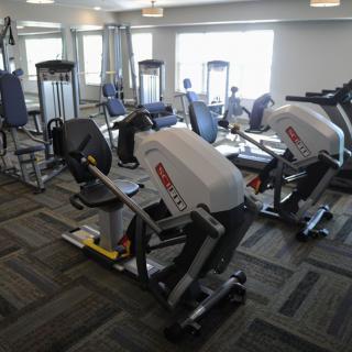 A fitness center equipped with various exercise machines.