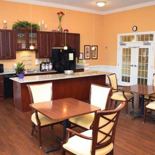 A cozy kitchen and dining area with wooden furniture and warm decor.