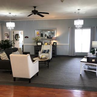 A cozy and well-decorated living room featuring a blend of modern and classic furniture.