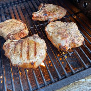 Delicious steaks grilling to perfection.