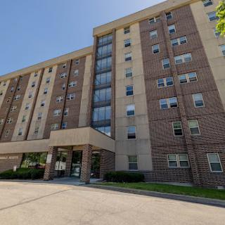 A multi-story residential building showcasing modern brick architecture.