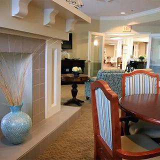 A modern living room and dining area with elegant furniture and decor.