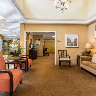 A well-furnished lobby area with comfortable seating and elegant decor.