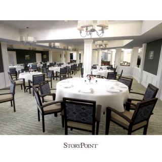 An elegantly arranged dining room set for a banquet event.