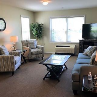 A cozy living room with comfortable seating and modern decor.
