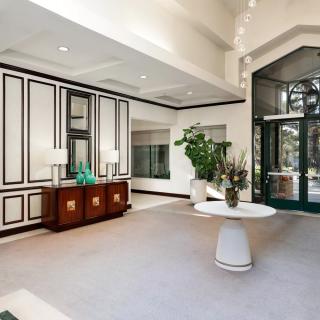 A modern lobby with elegant decor and bright lighting.