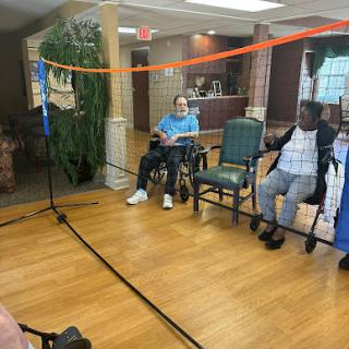 Residents participating in a recreational activity at a senior living facility.