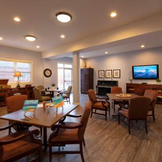A welcoming community living area featuring modern furniture and ample natural light.