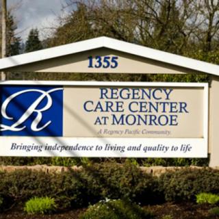Sign for Regency Care Center at Monroe with slogan about independence and quality of life.