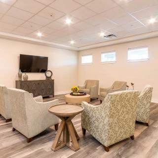 A modern living room with comfortable seating and a television.