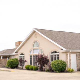 A suburban residential house with a well-maintained exterior and landscaping.