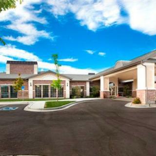 A welcoming facility with a bright blue sky in the background.