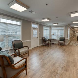 A spacious lobby with comfortable seating and large windows.