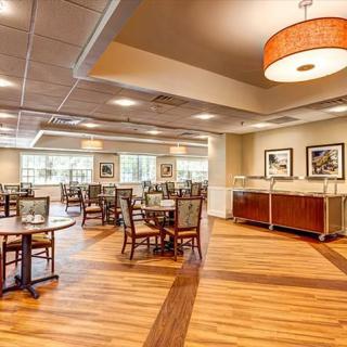 Spacious dining area with elegant interior design and ample seating.