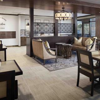 A modern hotel lobby with comfortable seating and stylish decor.