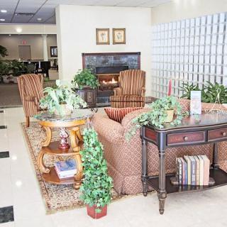 A cozy lobby with comfortable seating and a warm fireplace.