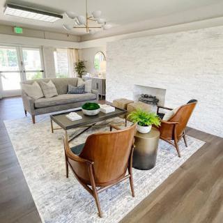 A modern living room with sleek furniture and a cozy atmosphere.