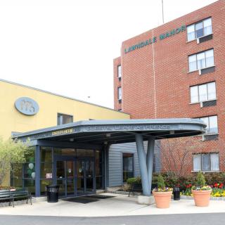 The exterior entrance of a hospital building.