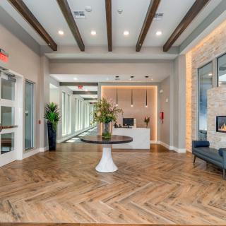 A modern lobby area with elegant wood flooring and stylish decor.