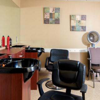 A modern salon interior featuring hair washing stations and styling chairs.