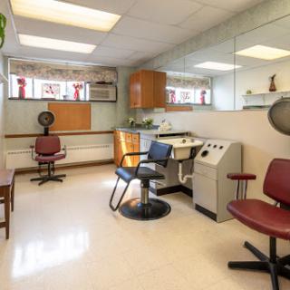 A tranquil healthcare space featuring salon-style chairs and medical equipment.