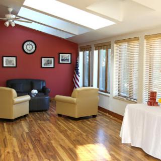 A cozy living room with comfortable seating and ample natural light.