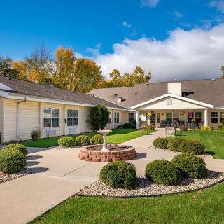 A beautifully landscaped residential building with a garden.