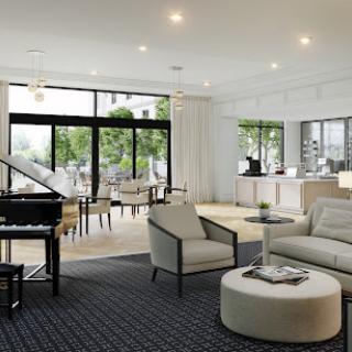 A stylish and spacious living room featuring modern furnishings and abundant natural light.