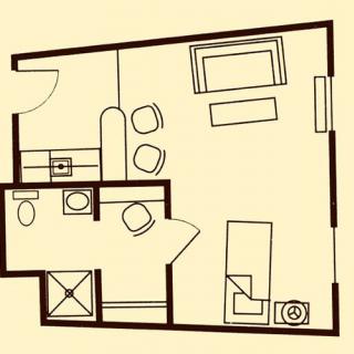 A floor plan of a small apartment showing the layout of the living room, kitchen, bathroom, and furniture arrangement.