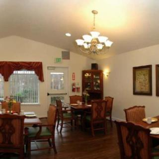 A cozy dining room with elegant furniture and a warm ambiance.