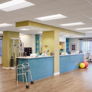 A modern rehabilitation center with therapy equipment and exercise tools.