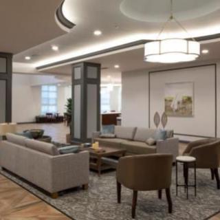 A modern living room with stylish furniture and lighting.