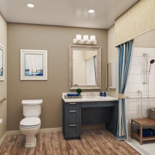 A modern bathroom interior featuring a toilet, vanity with a mirror, and a shower with blue curtains.