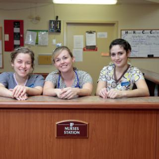 Friendly hospital staff at the reception desk.