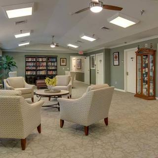 Modern lobby with comfortable seating and a small library.