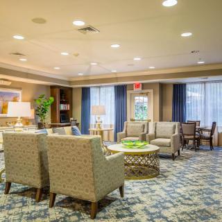 A cozy lobby area with comfortable seating and elegant decor.