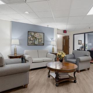A cozy living room with comfortable seating and elegant decor.