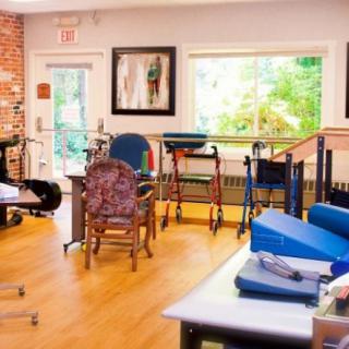 A rehabilitation facility equipped with various therapy tools and exercise equipment.