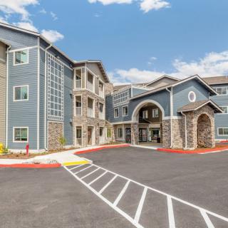 A modern multi-story residential building with a well-maintained exterior.