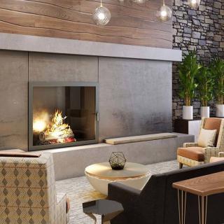 A modern living room with a cozy fireplace and stylish seating.