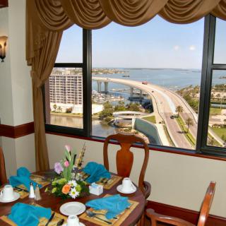 A luxurious dining area with a stunning ocean view through large windows.