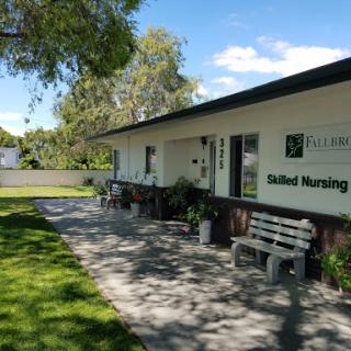 A skilled nursing facility with a welcoming outdoor area.