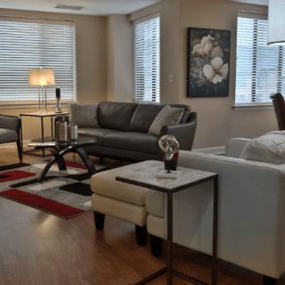 A modern living room with comfortable seating and stylish decor.