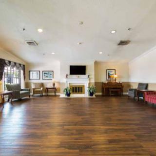 A spacious lobby featuring comfortable seating and a cozy fireplace.