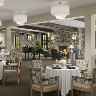 A sophisticated restaurant interior featuring elegantly set tables, a cozy fireplace, and a grand piano.