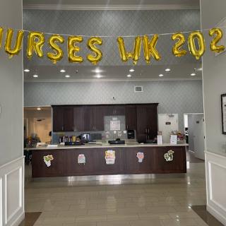 A festive display celebrating Nurses Week with golden balloons and a warm atmosphere.