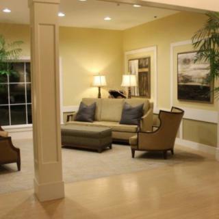 A cozy living room with elegant furniture and warm lighting.