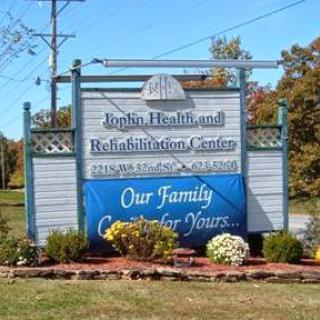 Sign for a health and rehabilitation center, showcasing their commitment to care and family support.